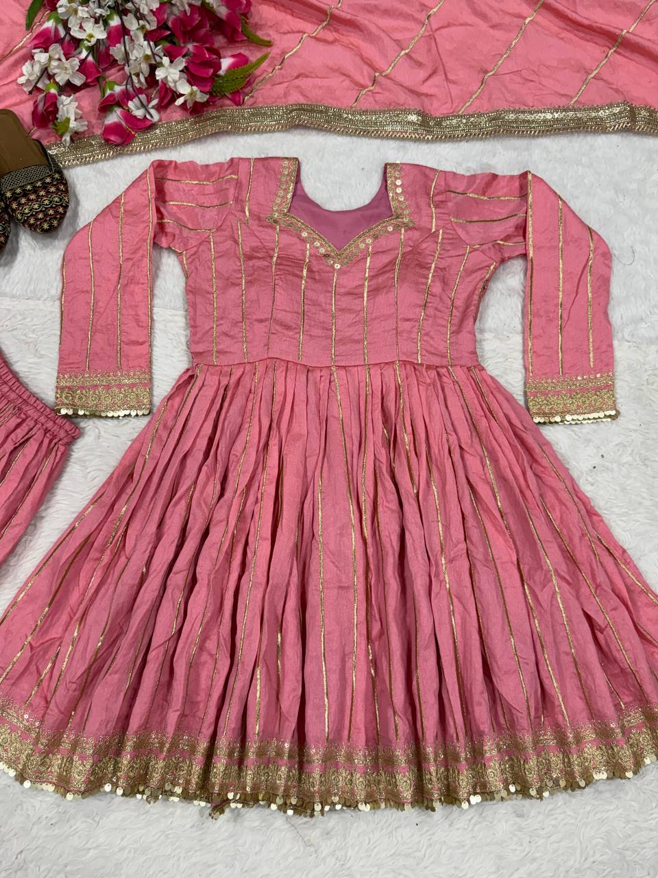 Radiant Rose Pink Flared Peplum Kurti and Sharara Set Embellished with Luminous Gold Zari Stripes and Sequined Borders